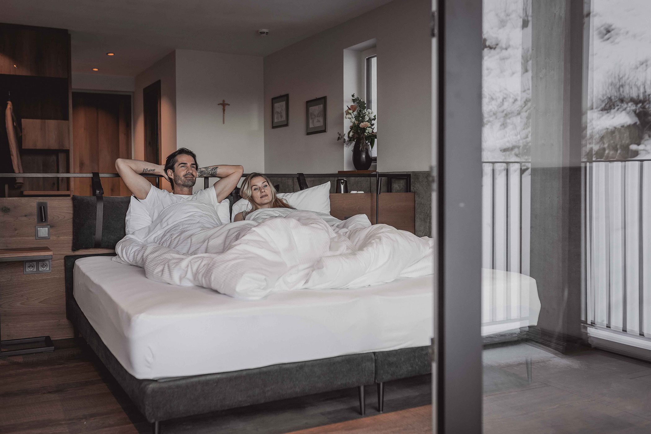 Gardena - Couple enjoying the view from their bed