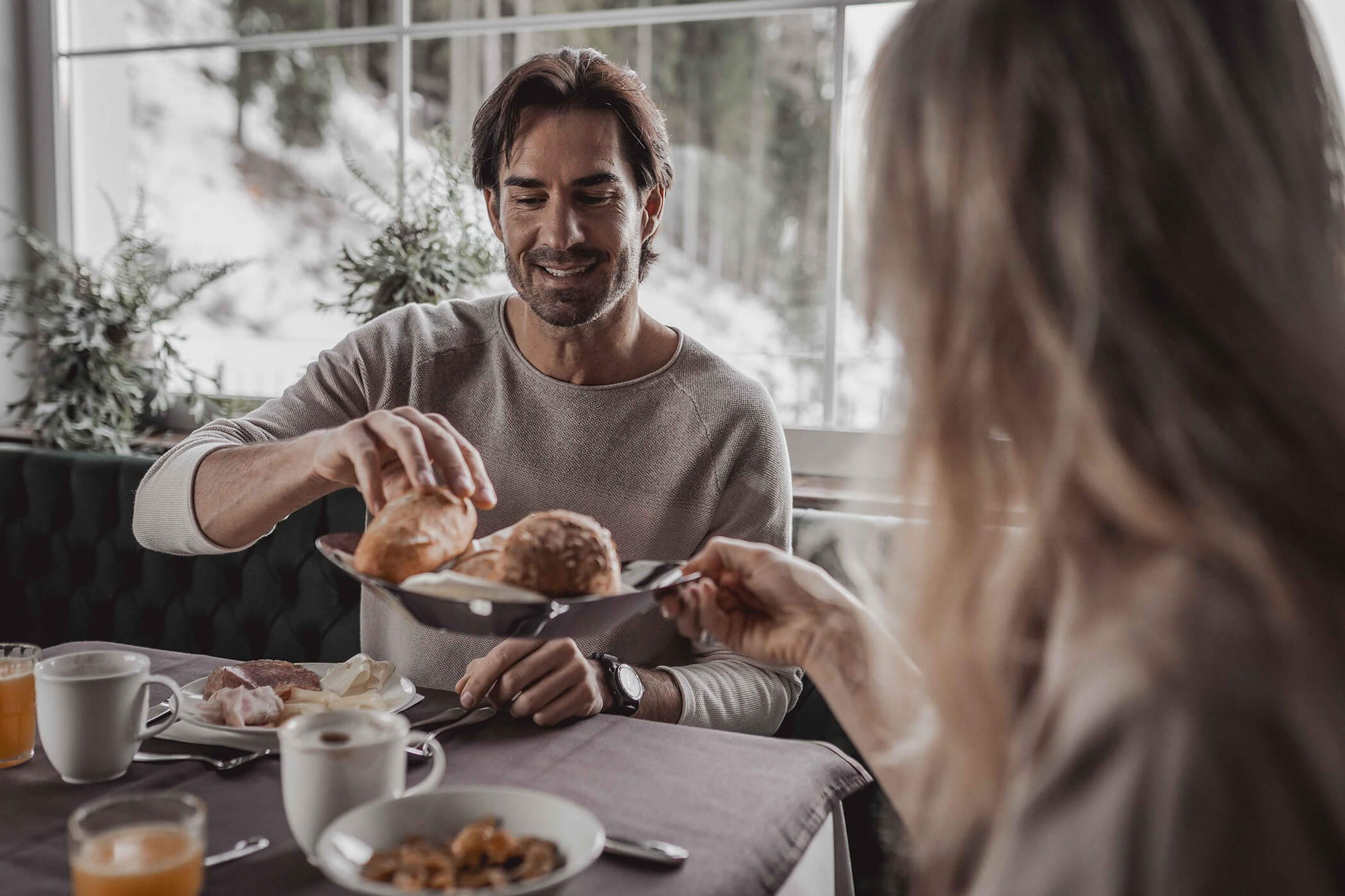 Man takes bread from woman's breakfast plate - Hotel Continental