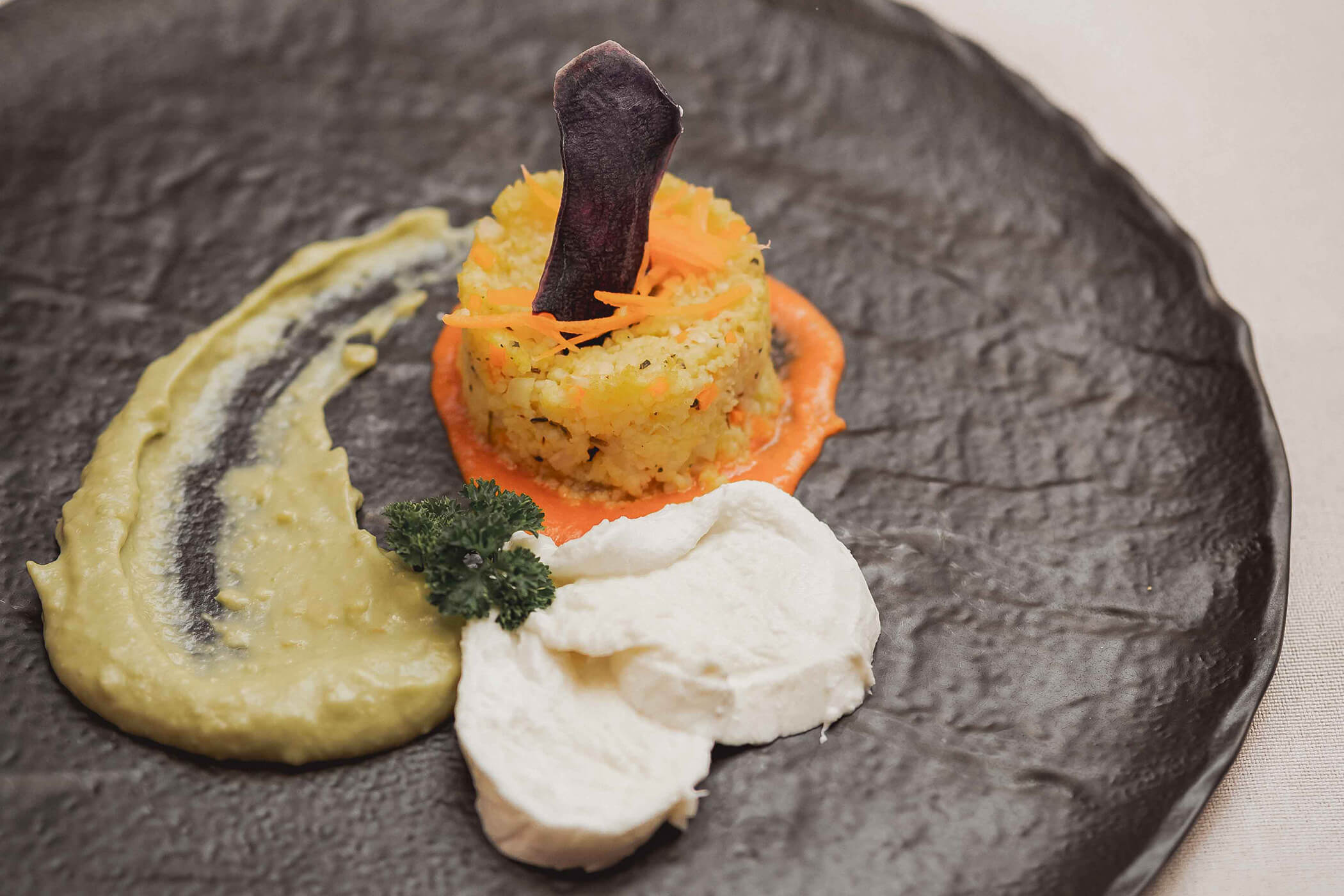 Appetizer: Couscous on a black plate - Hotel Continental