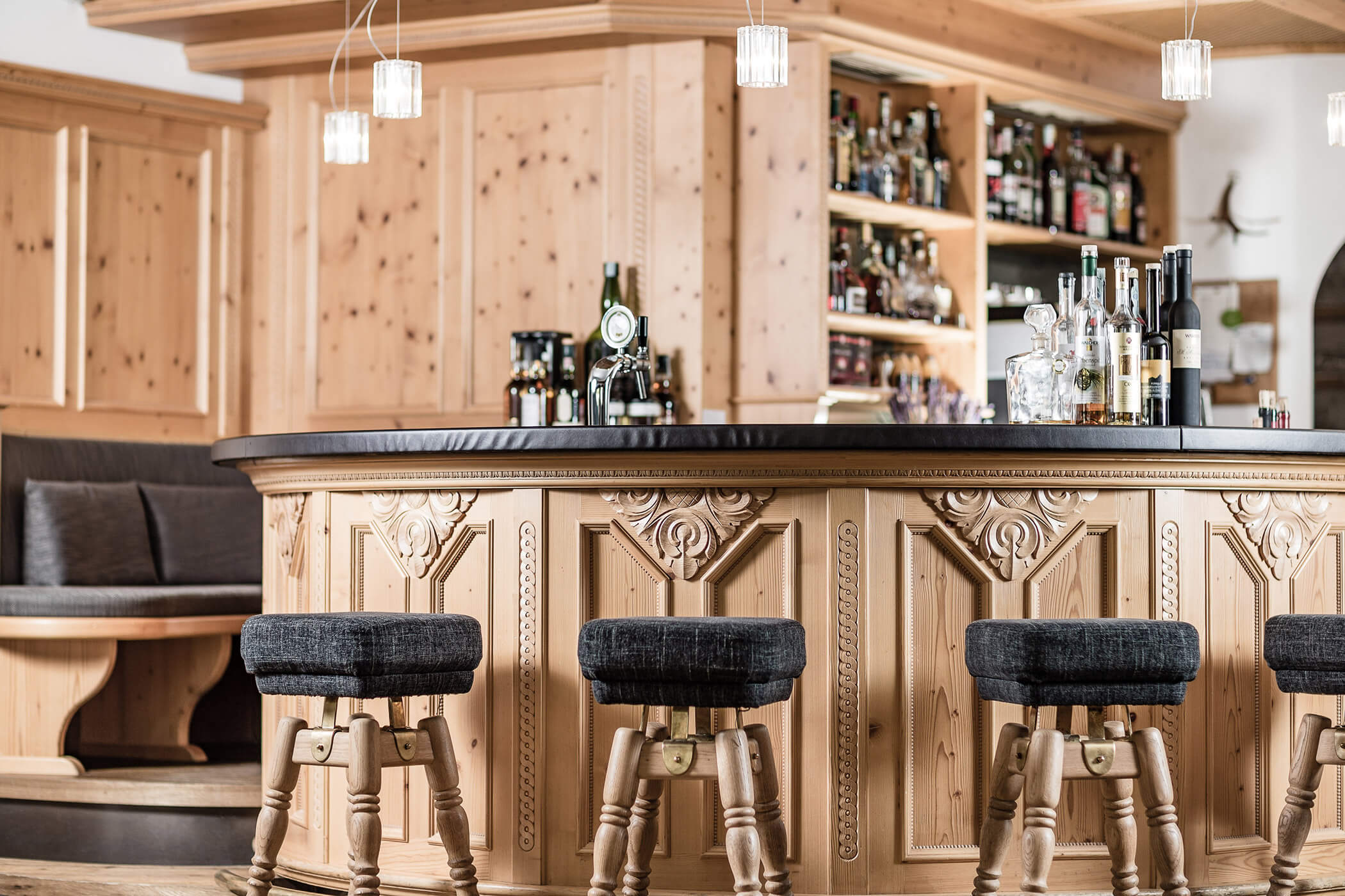 Hotel Continental bar with four bar stools and a seating area