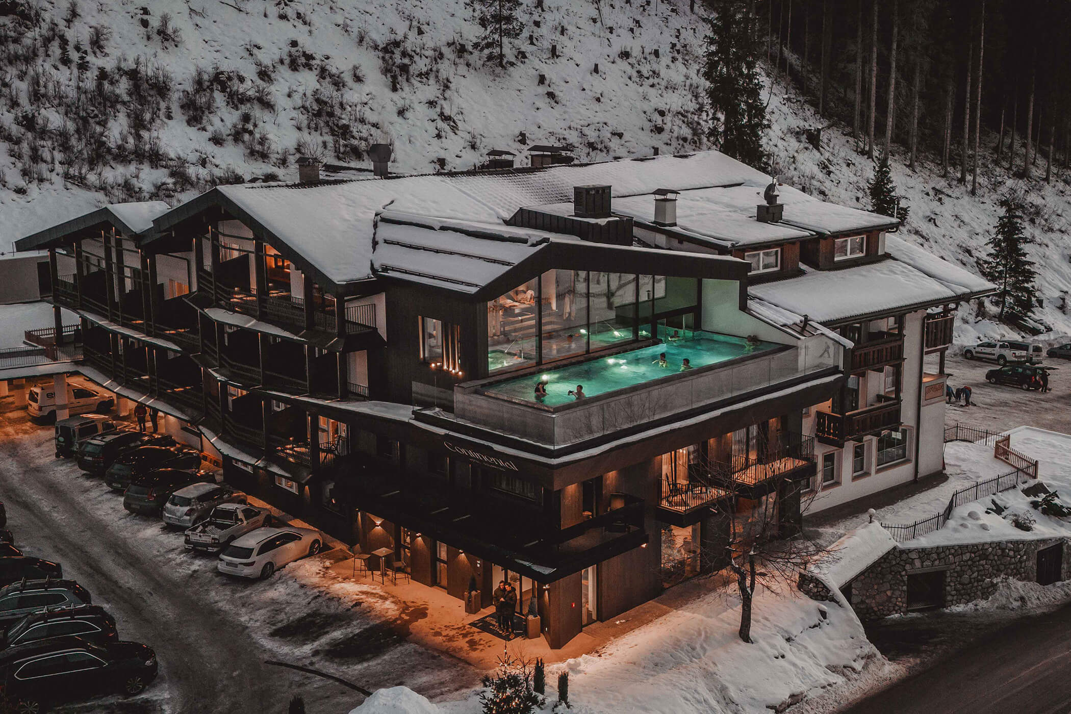 Hotel Continental from the outside with a view of the parking lot and infinity pool