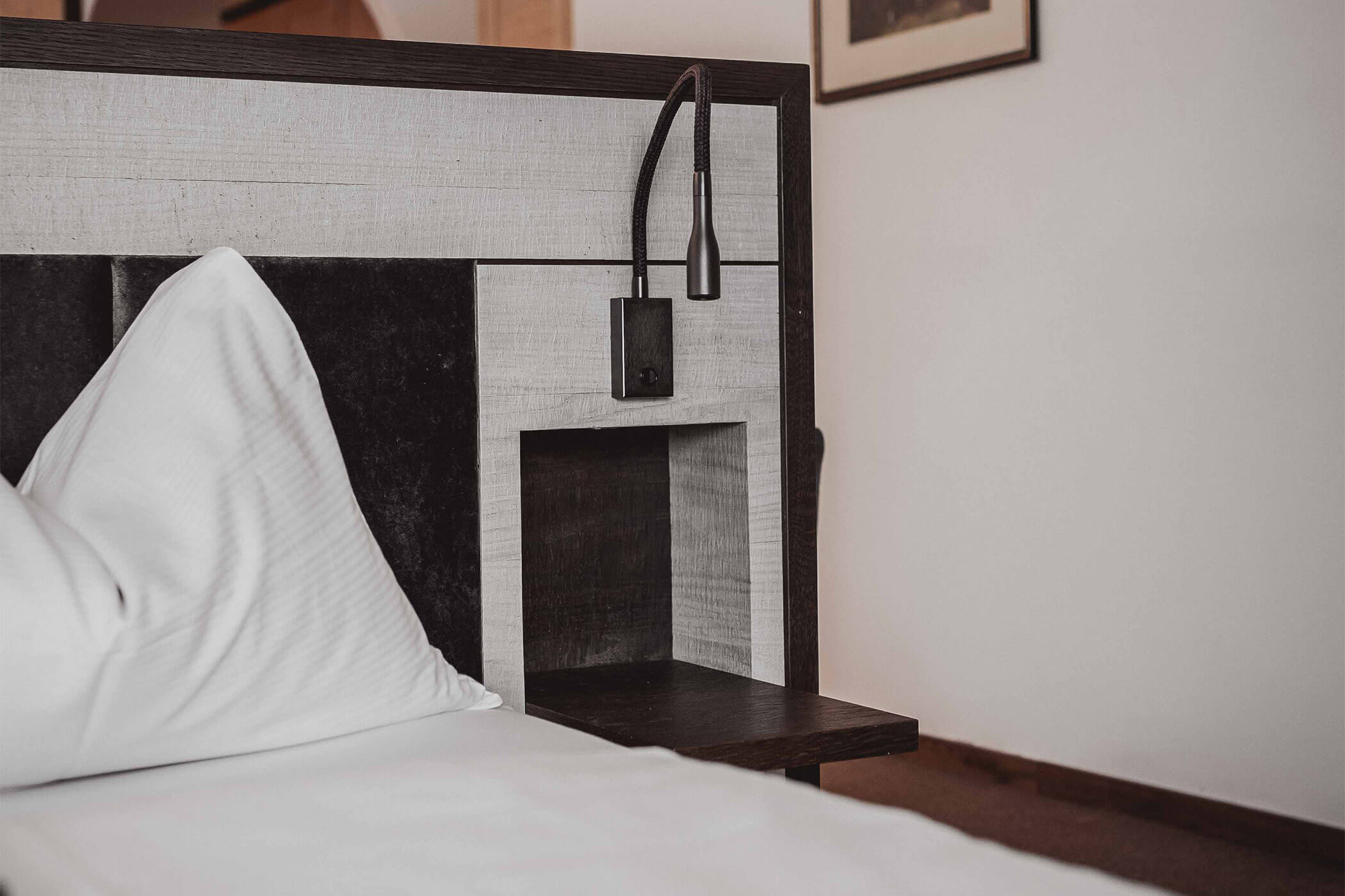 Reading lamp on the double bed in the Classic Junior Suite 