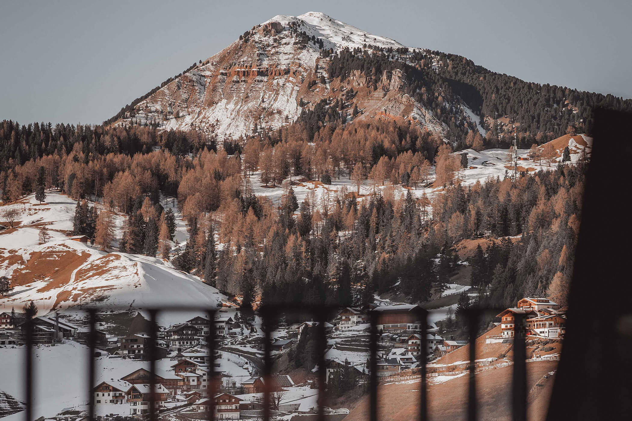 View of the partially snow-covered village of Selva di Gardena from the balcony - Hotel Continental